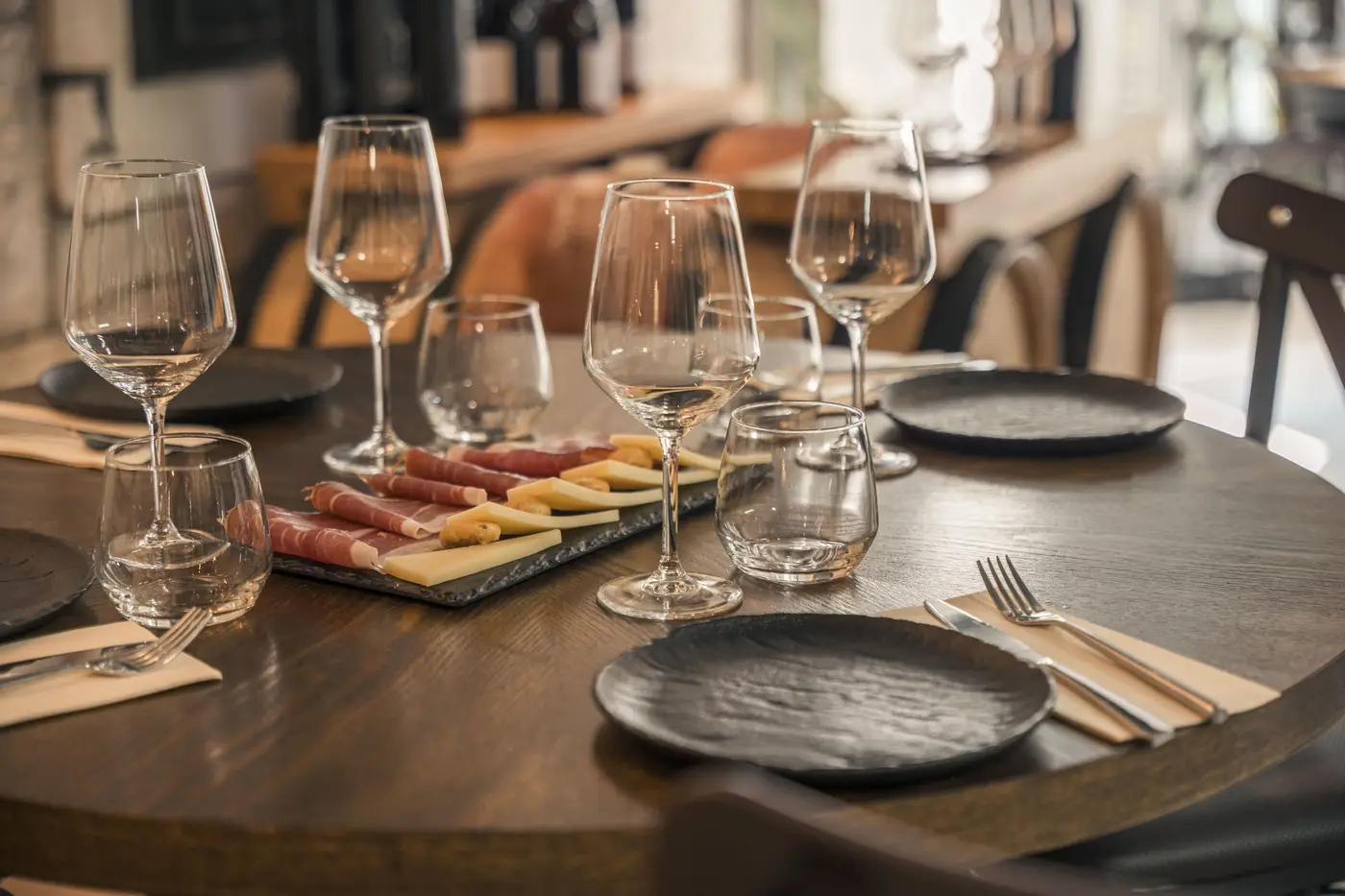 Table set for a wine tasting with glasses and Dalmatian appetizers